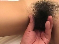 Asian whore sucks a weiner after getting her hairy cunt fingered