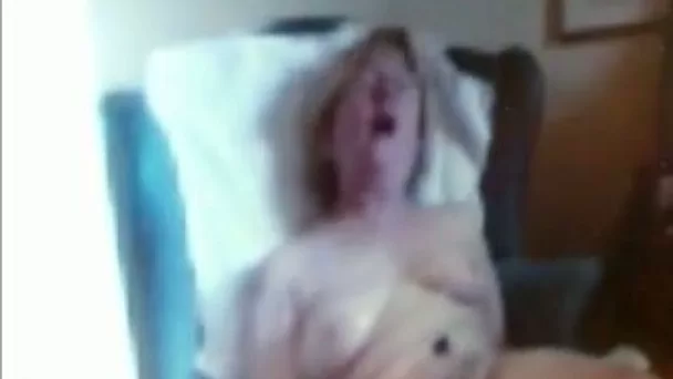 Old white blonde wife pleasing herself in the bedroom