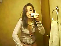 My bored brunette girlfriend in the bathroom taping herself