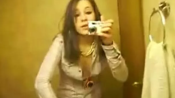 My bored brunette girlfriend in the bathroom taping herself