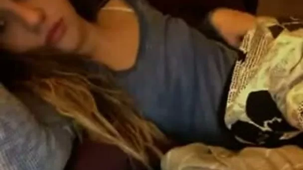 Nasty brunette college girl cuddles in her bed and masturbates