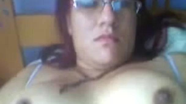 Colombian chubby wife lies on bed and rubs her sexy tits