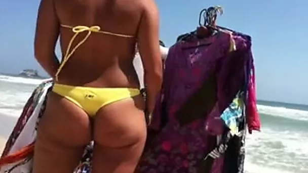 Another woman with a precious big ass on the beach