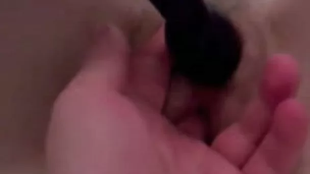 Girlfriend plays with a sex toy after missionary style sex