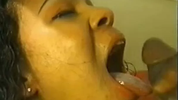 Curly haired ebony whore deepthroats my cock like a pro
