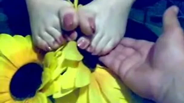 Watch my blonde wife demonstrating her pedicured feet for the cam