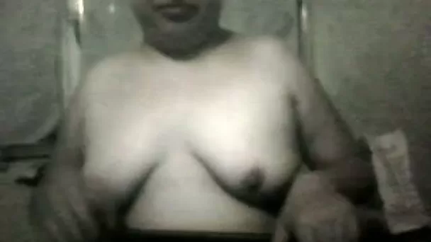 Ugly mature bitch shows her big natural tits for the webcam