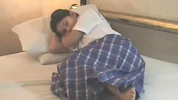 Nice Asian nympho is enjoying herself in the bedroom
