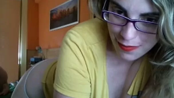 Bosomy amateur blonde shows her cleavage for the cam
