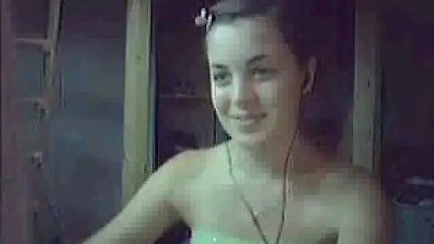 Brown-haired slut flashes her natural tits for the webcam
