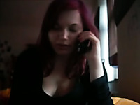 Redhead bitch plays with my cock while talking on the phone