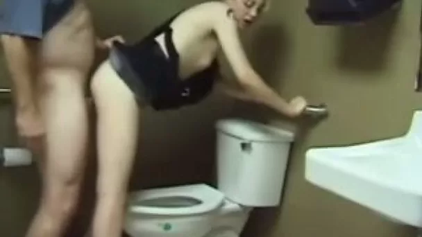 My buddy drilling a blonde whore's cunt in the toilet