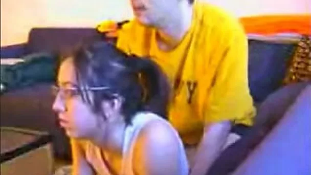 Nerdy brunette slut gets fucked from behind while playing videogame