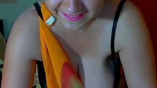 Chubby brunette milf shakes her oiled tits in front of a webcam