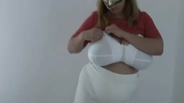 Huge-breasted masked mom plays with her boobs in homemade solo