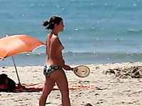 Topless cute girl on the beach is filmed on my voyeur tape