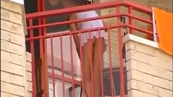 Hot petite blonde neighbor on the balcony filmed upskirt