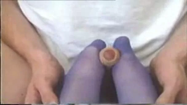 Lovely wife stroking my dick with her feet wearing pantyhose