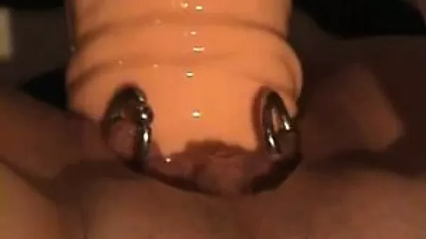 My naughty girlfriend fucks her pierced pussy with her big dildo