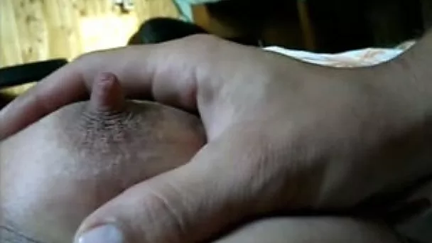 Playing with the soft nipples of my busty wife on cam