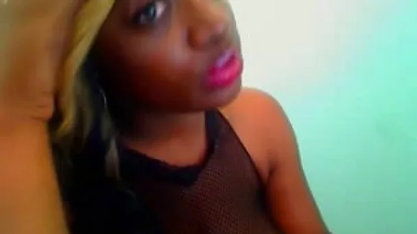 Exquisite black bimbo shows off her enormous tits on webcam