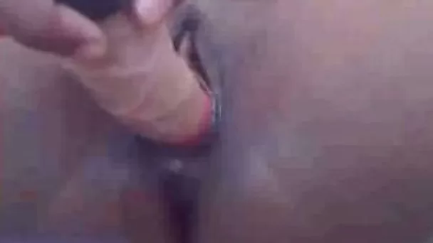 Toying my shaved creamy ebony pussy in the bathroom