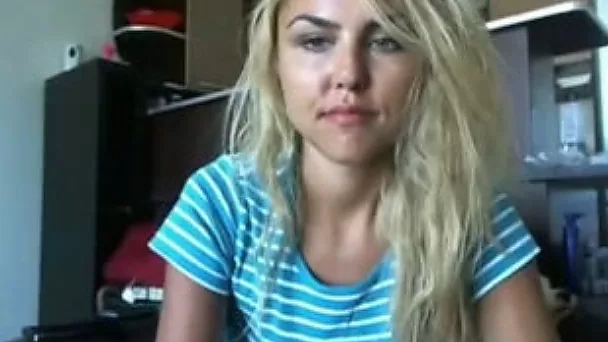Charming amateur blonde flashes her boobies for the webcam
