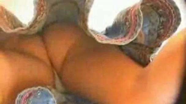 Petite brunette doesn't know that I film her upskirt