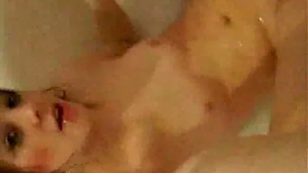 My punk girlfriend films herself masturbating with shower head