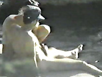 Student chick giving her mate a handjob on nudist beach - spy cam
