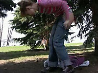 Russian girl in the park gets wet between her legs