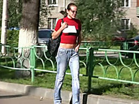 Lovely amateur brunette girl in jeans pisses in public