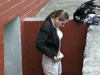 Busty Russian brunette pees in her pants on voyeur amateur video