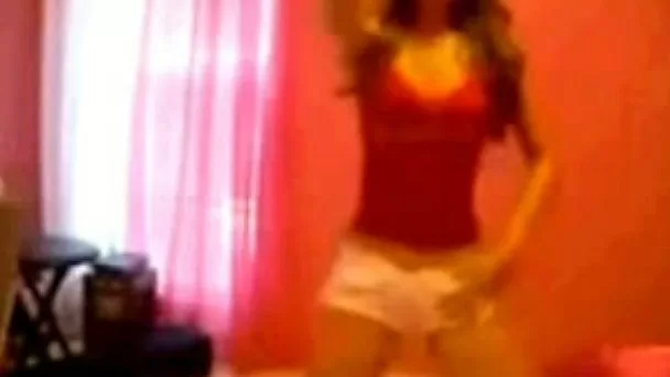 Exhibitionistic hoe in short shorts dances in a sexy way