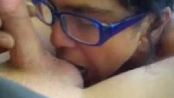 Prurient hooker in glasses is licking my shaft with enthusiasm