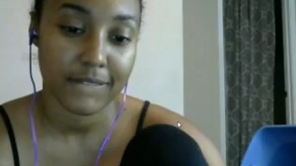 Charming exotic lady plays with her beautiful natural tits