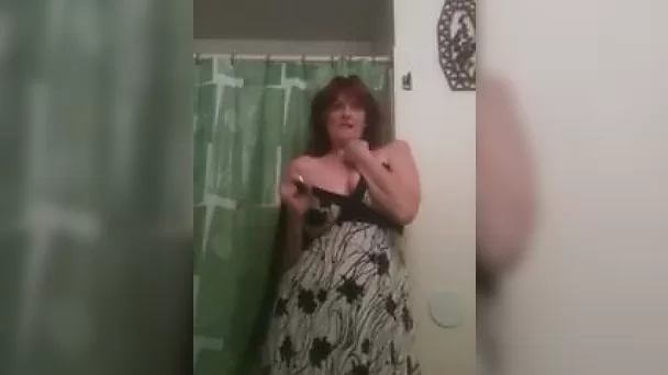 Self confident slut is showing off her saggy breasts