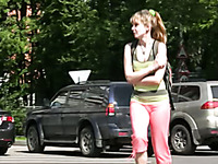 Slim girl pees in her legging while walking in the street