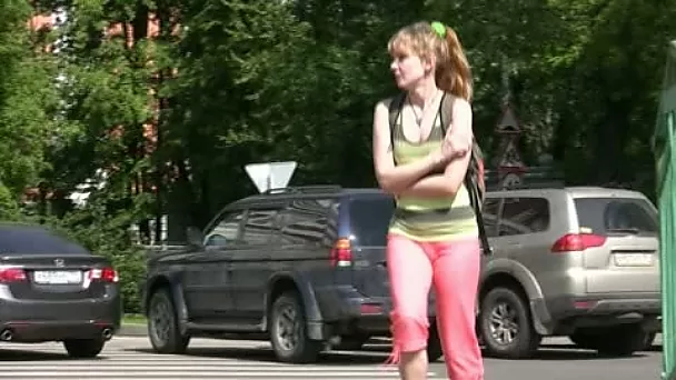 Slim girl pees in her legging while walking in the street