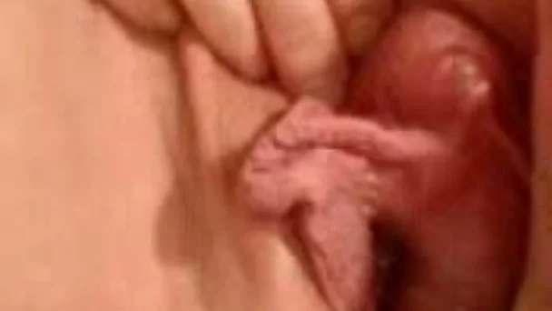 My bitch rubs her huge clit and her big pussy lips until cumming