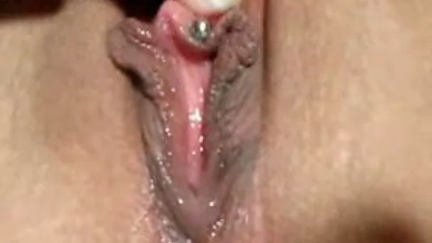 My lustful babe rubs her dripping wet pierced pussy on close up video