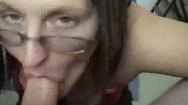 Pretty brunette in glasses giving a very nice blowjob