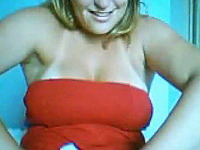 A slutty Brazilian blondie in red dress shows it all on webcam