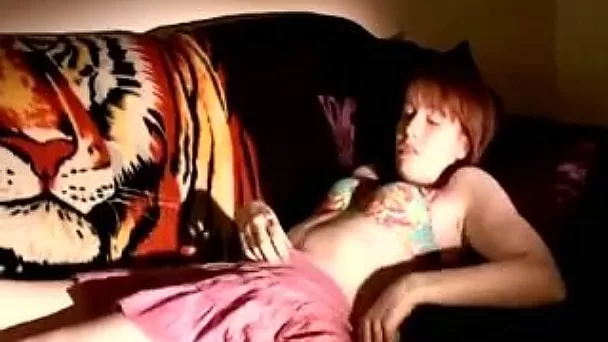 Captivating teen entertains herself by fingering her pussy
