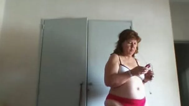 My plump wife feels comfortable dressing up in front of a camera