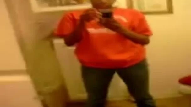 Stripping and masturbating ardently in front of a mirror