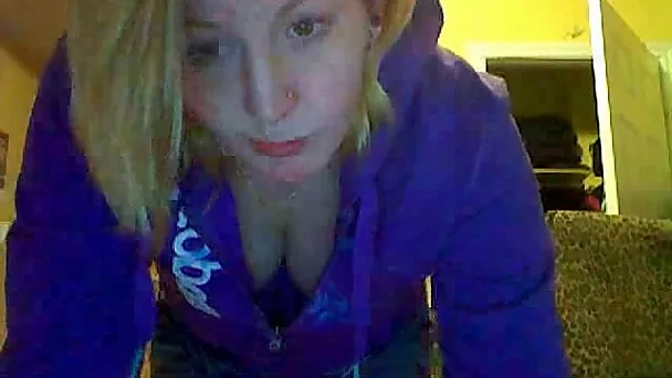 Sweet and busty blonde babe stripteasing on webcam