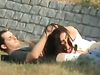 Spy cam clip with a teen couple making love in the park