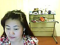 Webcam solo with a shy Asian girl flashing her natural tits