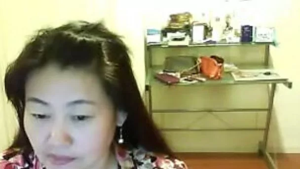 Webcam solo with a shy Asian girl flashing her natural tits